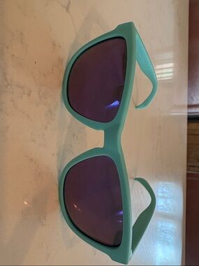 Goodr Turquoise Sunglasses with Dark Lenses- Electric Dinotopia Carnival
